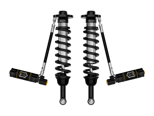 Two black coilover shocks with coiled springs and attached reservoirs, crafted for performance suspension systems, are ideal for a Ford F-150. This symmetrical setup features the ICON Vehicle Dynamics logo on each reservoir and is part of the ICON 21-23 Ford F150 4WD 3in Lift 2.5 VS RR CDEV Coilover Kit.
