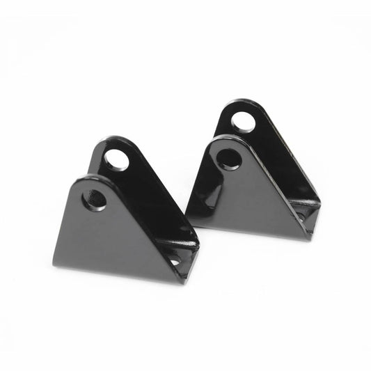 Two black metal Cognito Front Lower Shock Mount Brackets for 01-10 Silverado/Sierra 2500/3500 2WD/4WD, each triangular in shape with two holes near the top and a slot at the base, are shown against a plain white background. These components by Cognito Motorsports are essential for securing front shock mounts and ensuring proper droop travel when paired with Cognito upper control arms.
