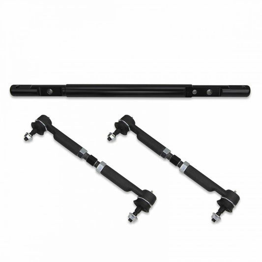 A black Cognito Extreme Duty Tie Rod Center Link Kit For 01-10 Silverado/Sierra 2500/3500 2WD/4WD by Cognito Motorsports, featuring an adjustable track bar with a radial-loaded joint for enhanced stability, is positioned horizontally above two parallel adjustable control arms, all placed on a white background and slightly angled outward.
