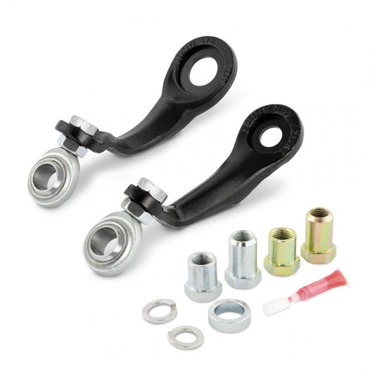 The image shows two black-painted metal steering arms with attached spherical rods, alongside various metal nuts, washers, and a small tube of lubricating grease. The components are laid out against a white background, likely indicating the Cognito Motorsports Forged Pitman Idler Arm Support Kit for Silverado/Sierra 2500/3500 2WD/4WD models from 2011 to 2024.