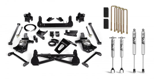 A collection of black and silver vehicle suspension parts, featuring the Cognito Motorsports 7-Inch Standard Lift Kit with Fox PSMT 2.0 Shocks for the 2011-2019 Silverado/Sierra 2500/3500 (2WD/4WD Stabilitrak), including components like shock absorbers, brackets, U-bolts, and various mounting parts, all arranged neatly on a white background.