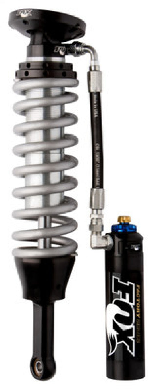 The FOX Factory Series 2.5 coilover set with DSC, featuring a black and silver design and attached hydraulic hose, is perfect for the 2007-2018 GM 1500 models with a BDS-only 4-inch lift kit, offering both durability and superior ride quality.
