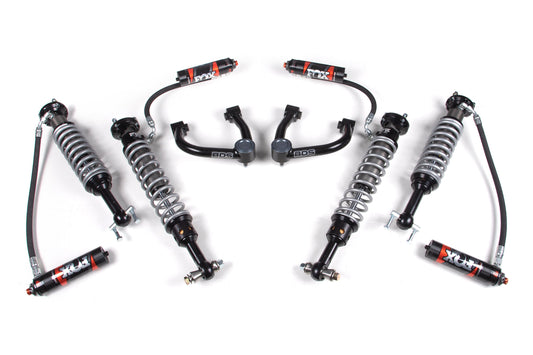 A set of automotive suspension components laid out on a white background, featuring a 3 Inch Lift Kit with FOX Performance Elite Coil-Overs and control arms, all branded with "FOX" and "BDS." The parts are symmetrically organized, designed for high-performance off-road use, making them perfect Ford Bronco accessories.