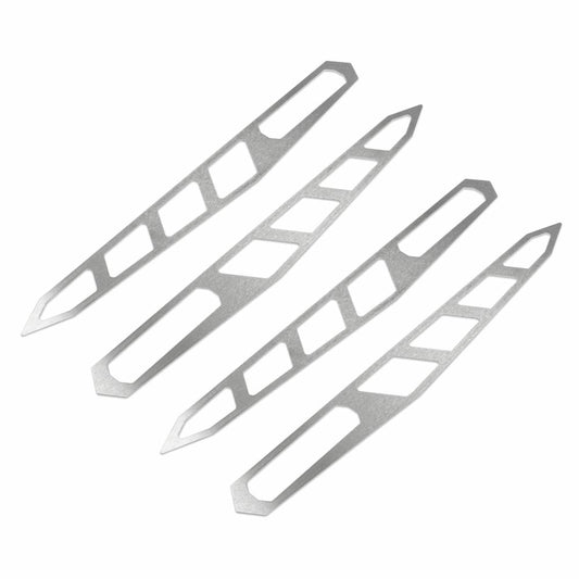 Four Cognito Enhancement Plate Kit strips from the Cognito Motorsports brand, designed specifically for the SM Series LDG Traction Bar Kit, made of stainless steel with a sleek, modern design. Each strip features cut-out geometric shapes arranged in a repeating pattern. The strips are angled diagonally, creating a dynamic layout against a plain white background that emphasizes their metallic shine.
