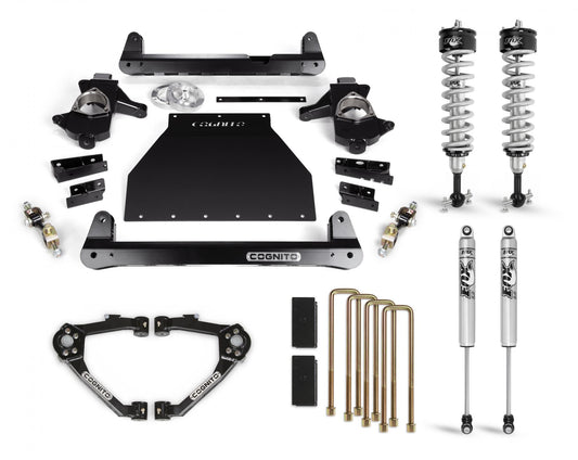 A set of automotive suspension parts displayed on a white surface. The components include shock absorbers, control arms, brackets, bolts, and other hardware. The neatly organized parts feature "Cognito Motorsports" branding and are designed as part of the Cognito 4-Inch Performance Lift Kit With Fox PS IFP 2.0 Shocks for the 2014-2018 Silverado/Sierra 1500 2WD/4WD.