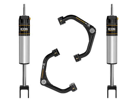 This set of automotive components includes the ICON 2020+ GM HD 0-2in 2.5 Series IR shock system with two shock absorbers in a metallic silver and black finish and two tube upper control arms. The black control arms feature advanced Delta Joint technology for superior corrosion resistance, prominently displaying the distinctive ICON logo and text.