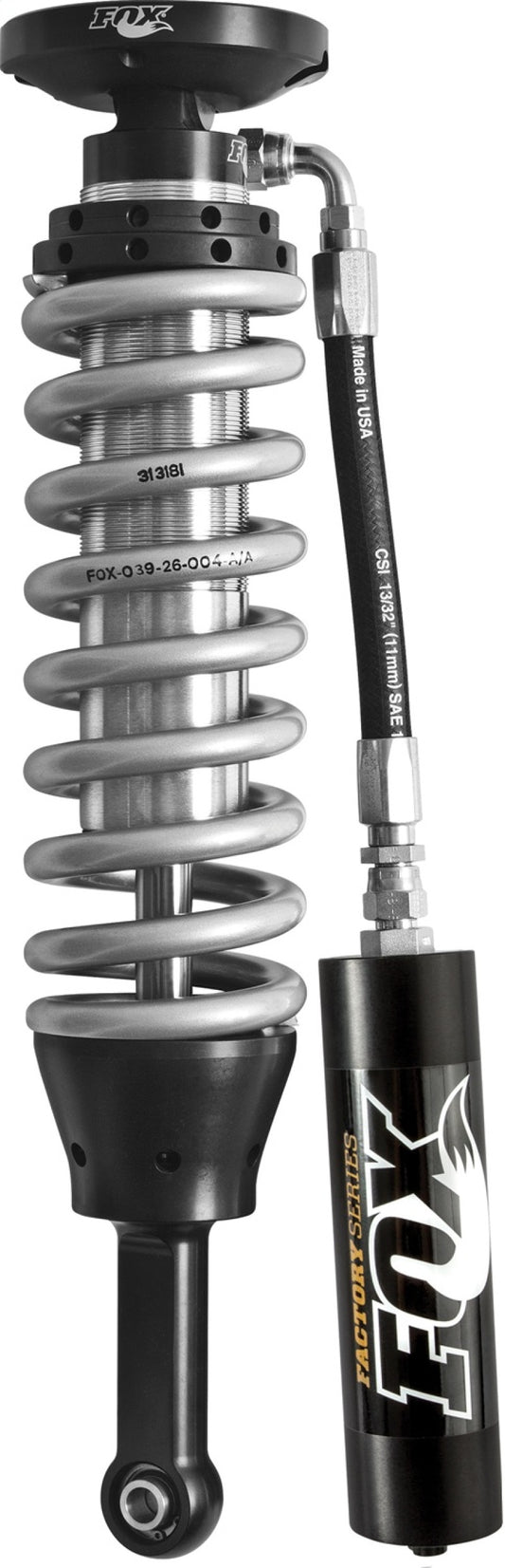 Close-up of a Fox 2009 F-150 2.5 Factory Series shock set in black/zinc, featuring a metallic coilover with an attached remote reservoir. Designed for off-road racing, it enhances ride quality and damping performance in vehicle suspension systems.