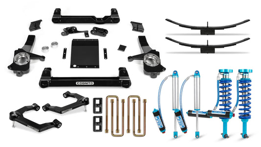 The Cognito Motorsports 6-Inch Elite Lift Kit with King 2.5 Remote Reservoir Shocks for the 2019-2024 Silverado/Sierra 1500 (2WD/4WD) includes a variety of vehicle suspension parts such as black control arms, Cognito components, coilovers with blue springs and blue reservoirs, U-bolts, lift blocks, leaf springs, and a metal skid plate.