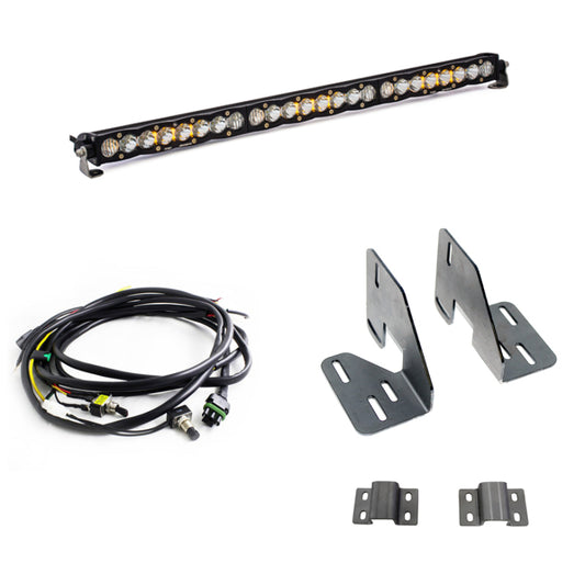 Image of a Baja Designs 18-19 GMC 2500/3500 HD S8 30in Light Bar Kit, ideal for trucks. It features an LED light bar, wiring harness with connectors, and metal mounting brackets.