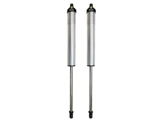 A pair of ICON 2001 GM HD 0-1in Rear 2.5 Series Shocks VS IR is shown side by side against a plain white background. Each shock absorber, from the ICON brand, features a silver cylindrical body and an extended rod with a black top cap, expertly engineered with Vehicle Specific technology.