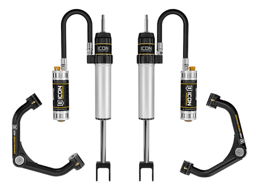 Image showcasing automotive suspension components including the ICON 2020+ GM HD 0-2in 2.5 Series CDCV Shock System with Tube Upper Control Arms. The black and silver parts, featuring V.S. 2.5 Aluminum Series shocks with reservoirs, prominently display the "ICON" branding and are expertly tailored for rugged off-road adventures.