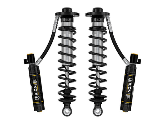 The ICON 22-23 Ford F150 Lightning Lowered Front 2.5 VS RR CDEV Coilover Kit includes two high-performance coilover shock absorbers with attached remote reservoirs, black coils, and branded labels, enhanced by the ICON CDE Valve for optimal control.
