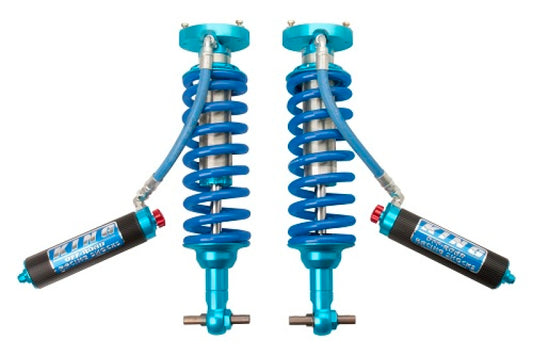Displayed against a white background are two expertly designed King Shocks 2019+ Chevrolet/GMC Silverado/Sierra 1500 Front 2.5 Dia Remote Reservoir Coilovers, specifically engineered for the suspension systems of these vehicles.