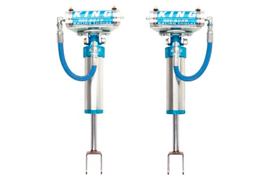A pair of King Shocks 2011+ Chevrolet Silverado 2500/3500 Front 2.5 Dia Remote Reservoir Shocks, known for their exceptional quality, are showcased against a white background with striking blue accents. These premium metallic shocks by King Shocks would make an ideal addition to a Chevrolet Silverado for off-road racing adventures.