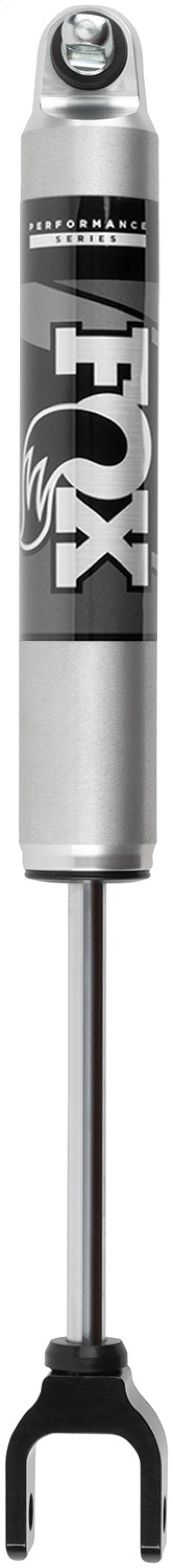 The Fox 20+ GM 2500/3500 HD 2.0 Performance Series IFP Front w/UCA Shock for a 1.5-2.5in lift, in silver and black with "FOX" branding and a flame design, delivers fade-resistant performance. It features a circular eyelet at the top for mounting and a forked end at the bottom, making it ideal for vertical positioning to enhance off-road capability.