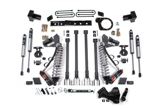 Image of a 7 Inch Lift Kit with 4-Link neatly laid out for the Ford F250/F350 Super Duty (20-22) Diesel. Components include coil springs, control arms, brackets, bolts, and various hardware. Pieces featuring BDS Suspension and FOX 2.5 Performance Elite Coil-Over shocks are arranged symmetrically on a white background, some parts labeled "BDS" and "FOX.