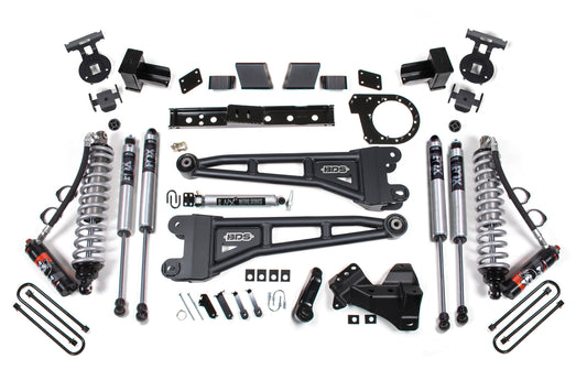 An array of off-road suspension system components, including shocks, control arms, brackets, and other hardware parts, arranged neatly on a white background. The BDS 7 Inch Lift Kit features FOX 2.5 Performance Elite Coil-Over Conversion and a 7-inch radius arm lift for enhanced vehicle performance in rough terrain for the Ford F250/F350 Super Duty (20-22) 4WD Diesel.