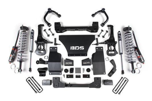 Image of a 4 Inch Lift Kit by BDS laid out on a white background, featuring FOX 2.5 Performance Elite Coil-Over shocks, control arms, brackets, and various mounting components designed for off-road protection for the Chevy Trail Boss or GMC AT4 1500 (19-24) 4WD Gas models.
