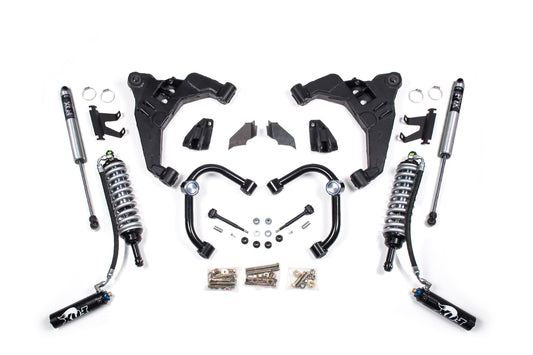 A neatly arranged assortment of car suspension parts includes FOX 2.5 Coil-Over shock absorbers with coils, upper control arms, various brackets, nuts, bolts, and other small hardware pieces. These components are part of the BDS 3 Inch Lift Kit | FOX 2.5 Coil-Over Conversion designed for Chevy Silverado or GMC Sierra 2500HD/3500HD (11-19) Diesel models and are symmetrically positioned on a white background.
