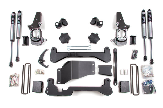 A flat lay photo of the BDS 4.5 Inch Lift Kit for Chevy Silverado or GMC Sierra 2500HD/3500 (01-10) SRW 4WD, showcasing shock absorbers, brackets, bolts, nuts, and various mounting hardware components neatly arranged on a white background. Ideal for upgrading your vehicle.