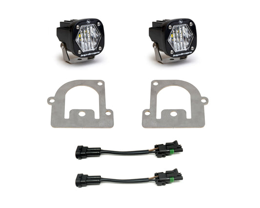 The Baja Designs 21+ Ford Bronco Sport S1 WC LED Fog Pocket Light Kit - Clear, crafted specifically for the Ford Bronco Sport, features two square clear LED lights with brackets, two metal mounting plates, and two wiring harnesses with connectors against a white background.