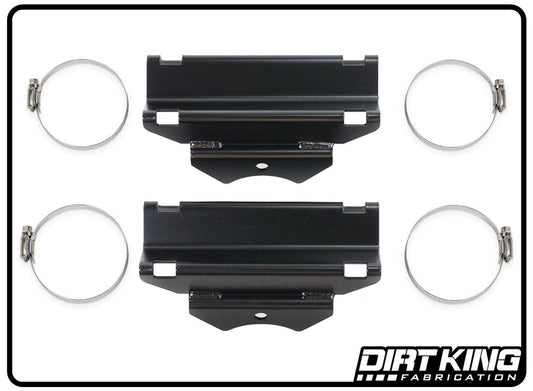 An image displaying two black metal brackets from the 07-18 GM 1500 Bolt-on Front Shock Reservoir Mounts by DIRT KING are placed horizontally at the center, surrounded symmetrically by four silver hose clamps on a white background. The "DIRT KING FABRICATION" logo is positioned in the bottom right corner.