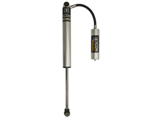 Image of the ICON 01-19 GM HD 0-1in Rear 2.0 Series Aluminum Shocks VS RR with a silver body and attached reservoir. The unit displays the "ICON" logo and features a black hose connecting the main cylinder to the reservoir, demonstrating precision engineering in advanced shock absorber technology.