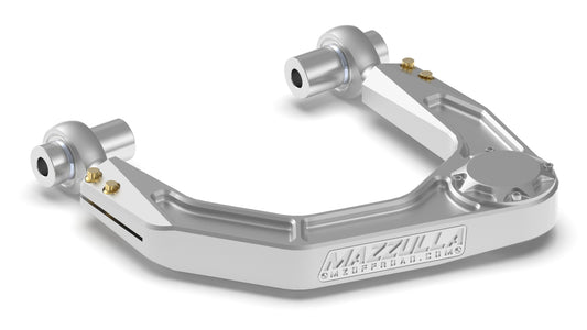 A silver MAZZULLA OFFROAD suspension component for 2021+ Ford Bronco features cylindrical attachments, uniball bearings, two mounting points, and two brass-colored fasteners. "MAZZULLA" is engraved on the side.